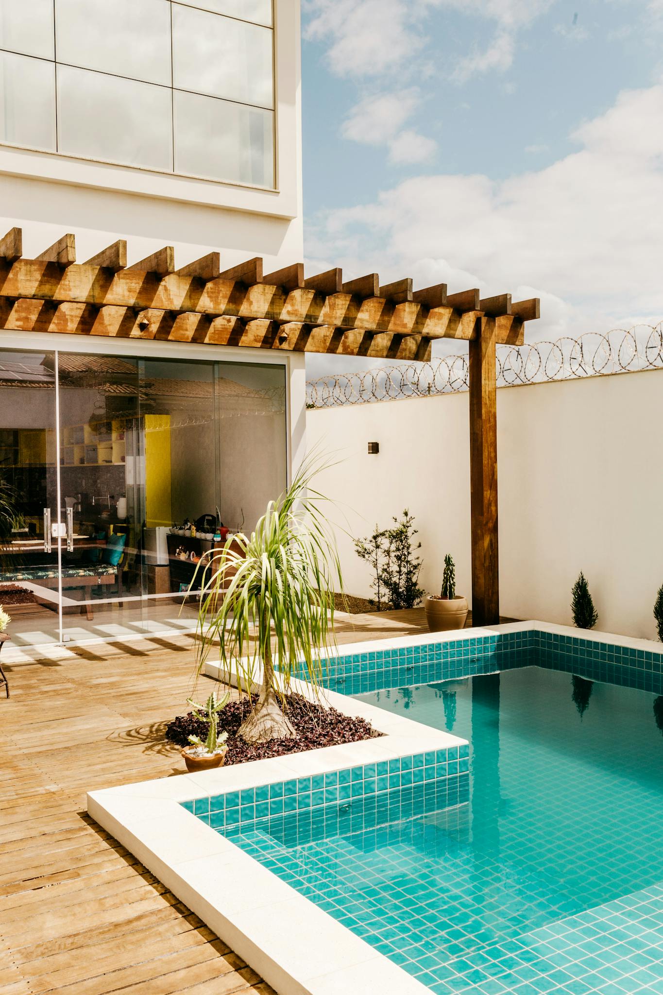 Contemporary villa featuring a relaxing poolside lounge and modern decor.